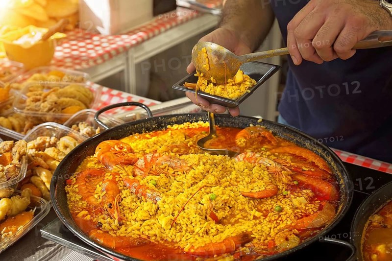 Paella preparation, street market stand near Barcelona Cathedral square