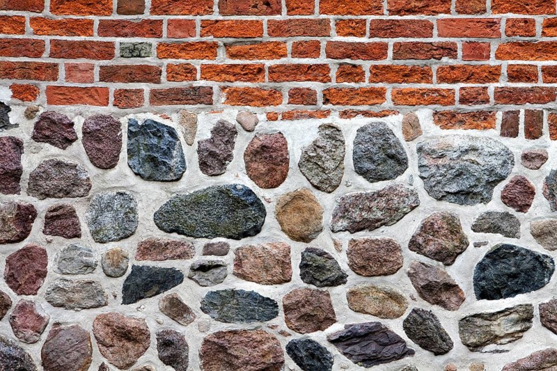 Old stone wall made of erratics rocks and bricks, Church of St. Urbanus, Dorum, Lower Saxony, Germany, Europe, Steinmauer aus Feldsteinen und Ziegelsteinen, Kirche St. Urbanus, Dorum, Niedersachsen, Deutschland, Europa