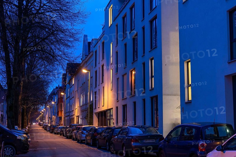 Residential street, many apartment buildings in a residential neighbourhood, evening, lantern lighting, Essen, North Rhine-Westphalia, Germany
