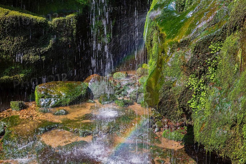 Splashing water of the Amsel Falls, a waterfall near the village of Rathen in Saxon Switzerland National Park, Saxony, Germany