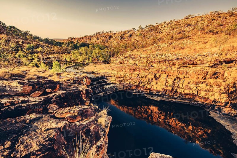 Bell Gorge waterfall, a body of water in north-west Australia in the Kimberley. Sunrise in the outback, Australia
