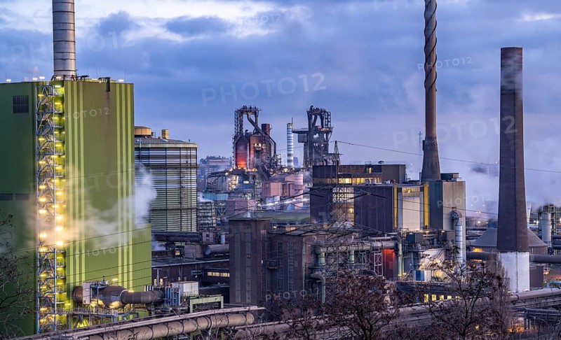 Panorama of the Thyssenkrupp Steel steelworks in Duisburg-Bruckhausen, in front the gas-fired power plant Hamborn, green facade of the boiler house Block5, in the centre the blast furnaces 8 and 9, North Rhine-Westphalia, Germany