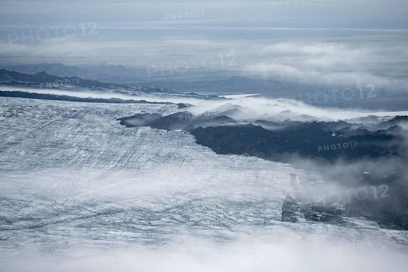 Fog, clouds rising from the glacier in the evening, Myrdalsjökull glacier, Pakgil, Iceland