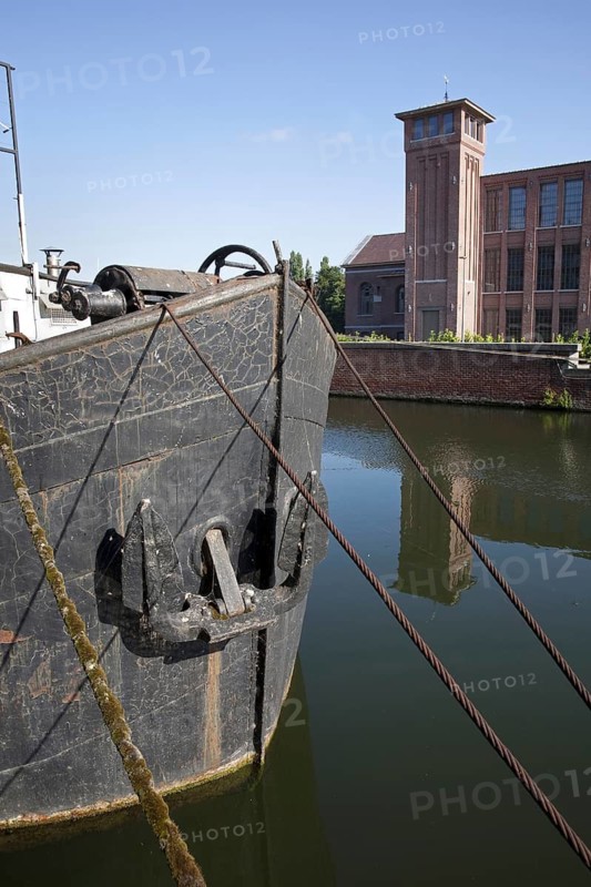 Bow of old canal boat on the river Leie, Kortrijk, Flanders, Belgium