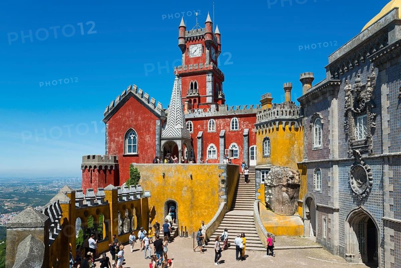 Colourful palace with red and yellow facades, many visitors and stairs, Palácio Nacional da Pena, National Palace Pena, Sintra, Lisbon, World Heritage Site, UNESCO, Portugal