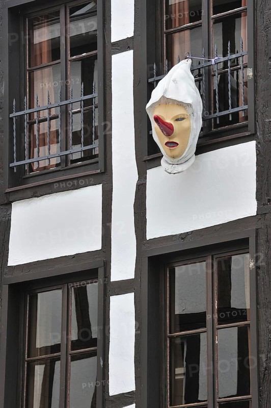 Blanc Moussis mask hanging from house front at Stavelot, Ardennes, Belgium