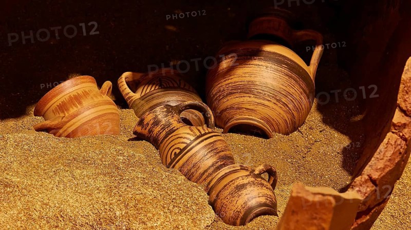 Tomb urns, Protogeometric period, several ancient clay vessels with patterns on sandy ground, Pylos Archaeological Museum, Neokastro, Pylos, Peloponnese, Greece