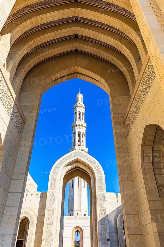 Arched gates and minaret of the Sultan Qaboos Mosque, Muscat, Arabian Peninsula, Sultanate of Oman