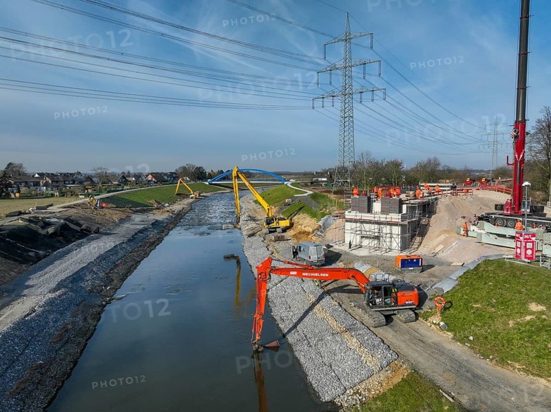 Dinslaken, Voerde, North Rhine-Westphalia, Germany - New Emscher estuary into the Rhine. New construction of the railway bridge and restoration of the dykes after dyke erosion during the 2023 flood. Renaturalisation of the Emscher. Flood protection through land expansion. The mouth of the Emscher into the Rhine was moved almost 500 metres north from Dinslaken to Voerde. Fish can now swim up the new Emscher from the Rhine through a newly created floodplain area without any barriers. Following the construction of a parallel sewer, the Emscher has been completely free of sewage since January 2022. The river was previously an open, above-ground combined sewer with rainwater and wastewater