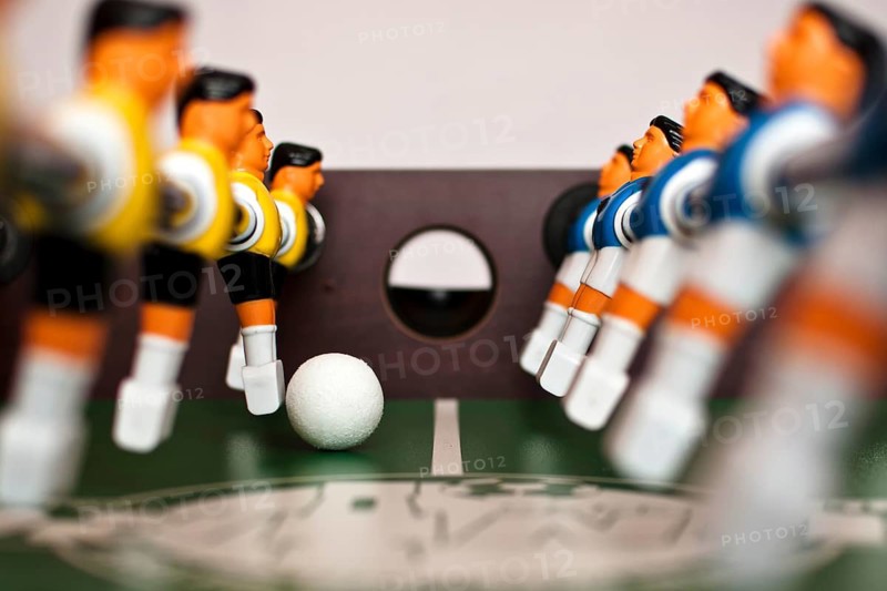 Football table players and balll close up