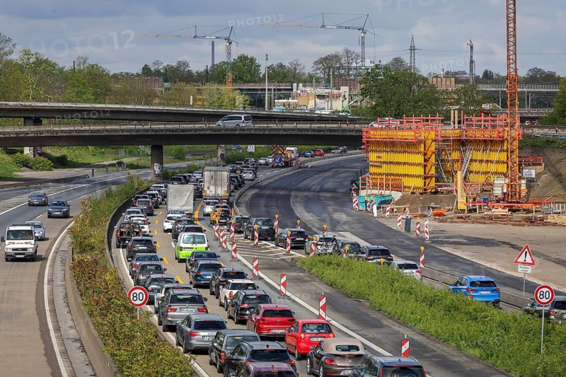 Duisburg, North Rhine-Westphalia, Germany, traffic jam on the A40 motorway at the Kaiserberg junction. The busy area with the A40 and A3 motorways has been undergoing renovation and expansion for years. There are always closures or restrictions for motorists there
