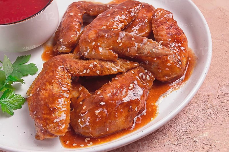 Chicken wings, with barbecue sauce, with tomato sauce, fast food, no people