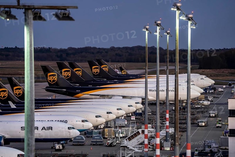 Cologne-Bonn airport, CGN, air freight center, UPS Logisic Hub, UPS cargo aircraft on the apron, Star Air Cargo aircraft, Maersk, at the logistics center, in the evening