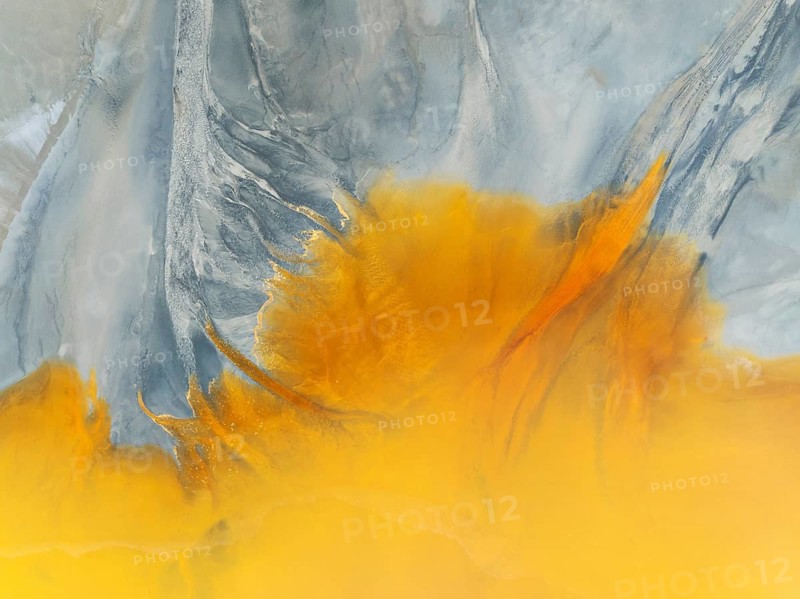 Waste pond in the mineral-rich area of the Rio Tinto mines. The colour is caused by oxidised iron minerals. Aerial view. Drone shot. Huelva province, Andalusia, Spain