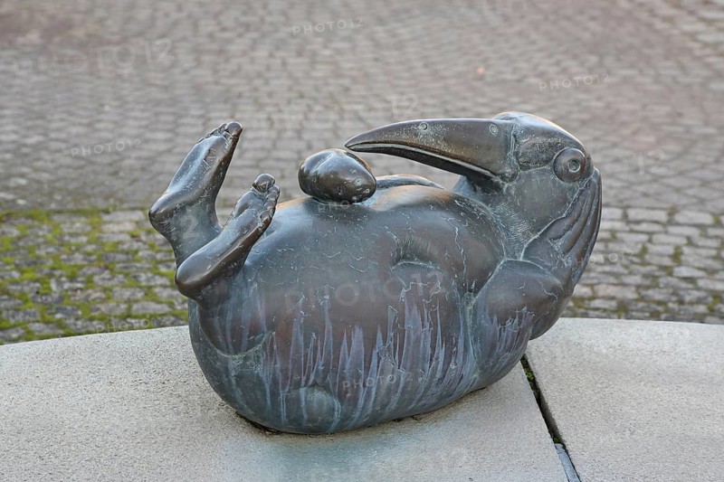 Bürgerbrunnen sculpture by Gernot Rumpf, potato drit, bronze sculpture, modern art, thirsty, Elvetrich, fantasy creature with long beak lying on the back, legs up, potato, curious, funny, humorous, Friedelsheim, Wachenheim, German Wine Route, Rhineland-Palatinate, Germany