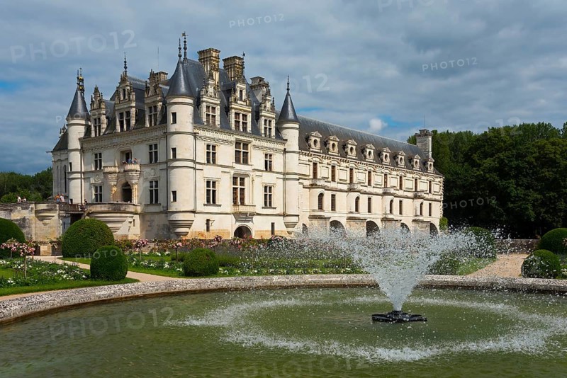Majestic castle with manicured gardens and fountain on a slightly cloudy day, Chenonceau Castle, Château de Chenonceau, moated castle, Cher River, Chenonceaux, Indre-et-Loire, Centre-Val de Loire, France