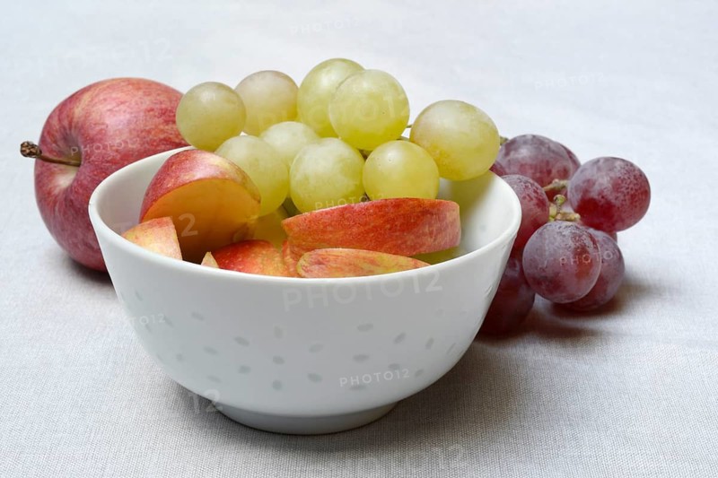 Apple slices and grapes in skin