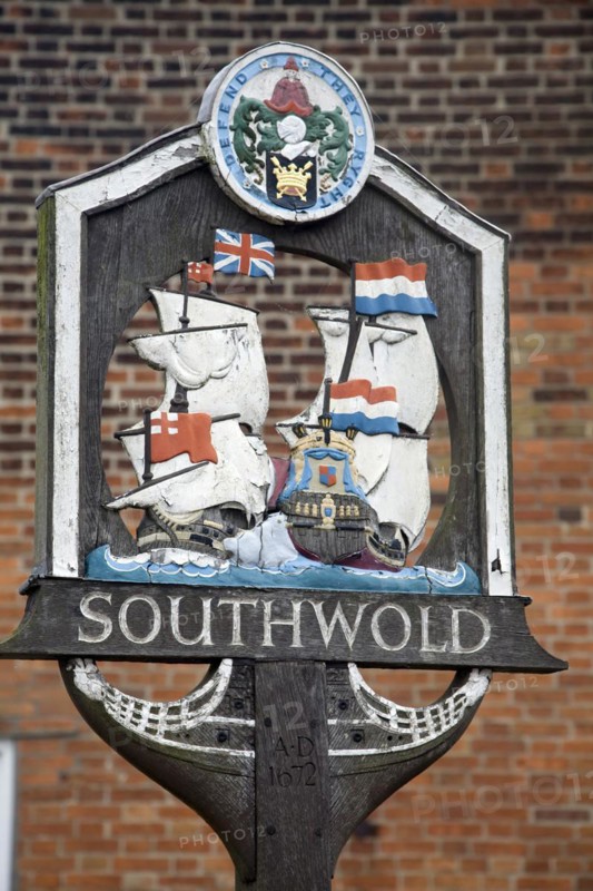 Village sign showing ships engaged in the Battle of Sole bay, Southwold, Suffolk, England, United Kingdom