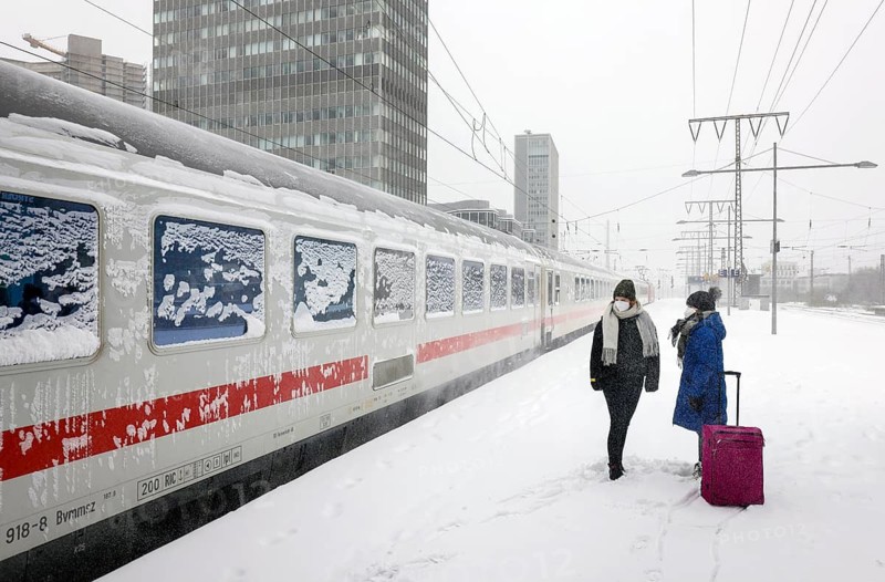 Essen, North Rhine-Westphalia, Germany - Onset of winter in the Ruhr area, Essen railway station, many trains delayed or cancelled due to ice and snow, passengers waiting for trains