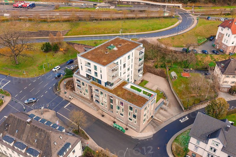 Modern building complex at a major road junction with adjacent nature, Nagold, Calw district, Germany