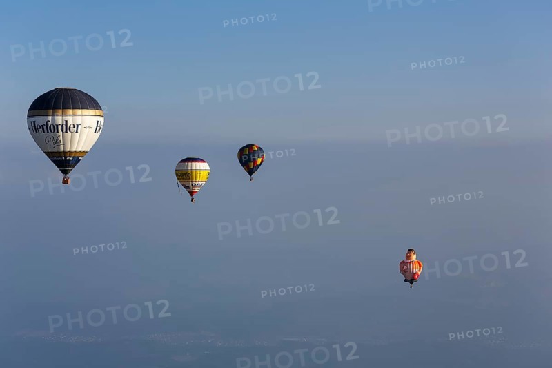 Four different hot-air balloons in the evening haze, advertising, logo, hot-air balloon festival, 26th Warsteiner International Montgolfiade, aerial photo, Warstein, Sauerland, North Rhine-Westphalia, Germany