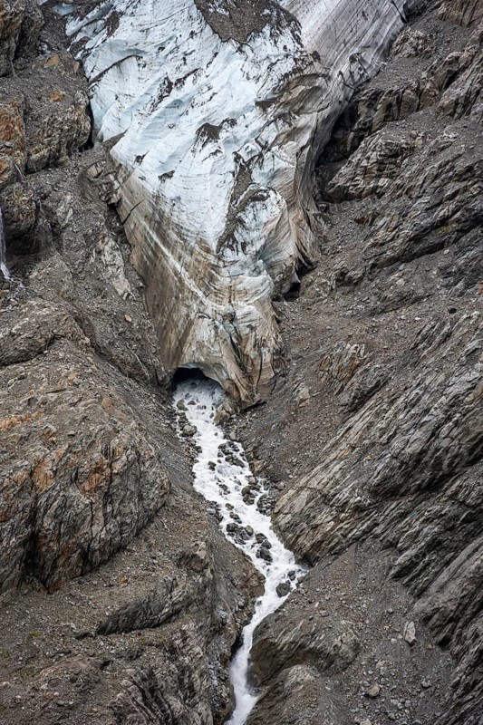 Glacier tongue and mouth with stream, mountain landscape, Grindelwald-Fiescherfirn glacier, Bernese Alps, Bernese Oberland, Switzerland
