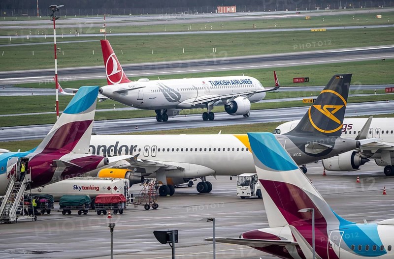 Düsseldorf Airport, Eurowings, Condor aircraft on the apron, Turkish Airlines Airbus on the taxiway for take-off, Düsseldorf, North Rhine-Westphalia, Germany