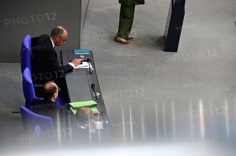 Federal Chancellor Friedrich Merz (CDU) and parts of his cabinet sit on the government bench, whilec, co-chair of the Greens parliamentary group, responds to the Federal Chancellor's government statement