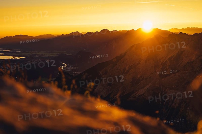 View from the Aggenstein and the foothills of the Alps in Ostallgäu and the Ammergebirge at sunrise, Bavaria, Germany