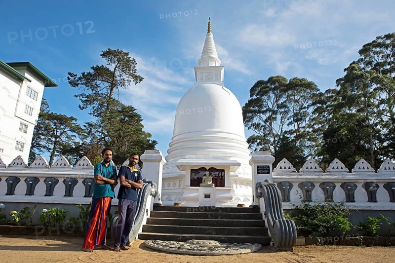 Sri Lankan men at the Chayathi Stupa in the International Buddhist Centre Temple, Nuwara Eliya, Central Province, Sri Lanka