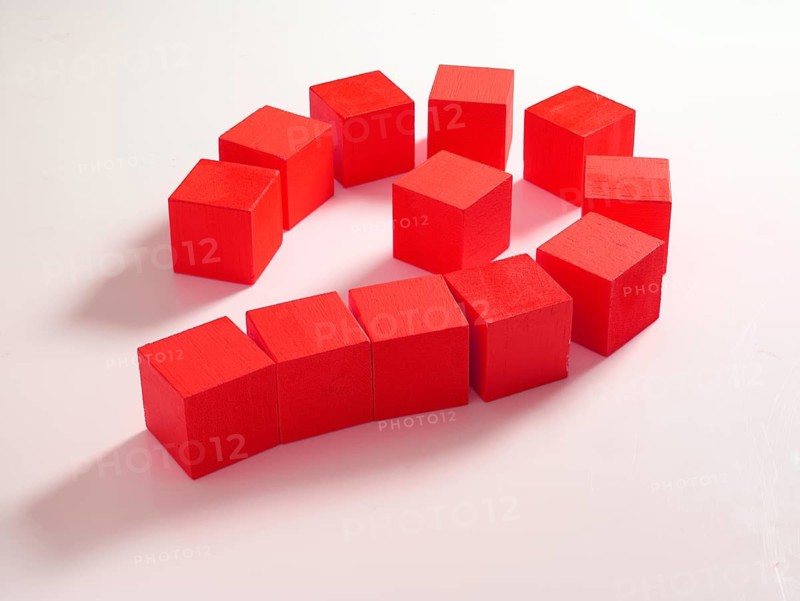 12 red wooden cubes against a white background