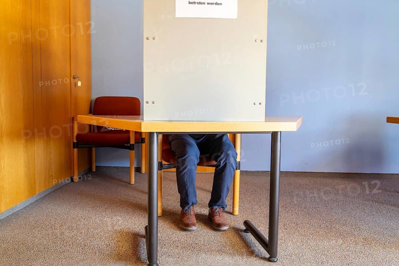 Election symbol: Man in the voting booth