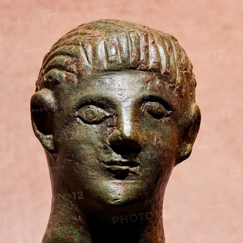 Diocouroi or athlete, ancient bronze sculpture of a head with neutral expression and fine details, Pylos Archaeological Museum, Neokastro, Pylos, Peloponnese, Greece