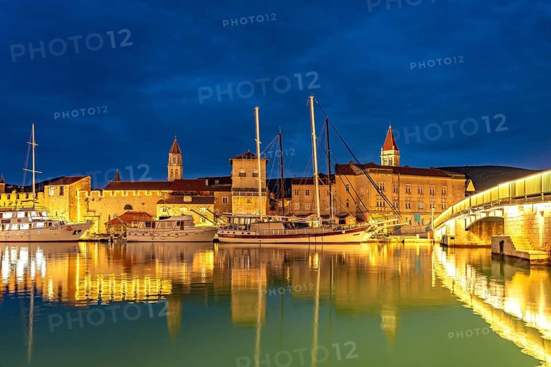 Cruise ships in front of the old town centre of Trogir at dusk, Croatia