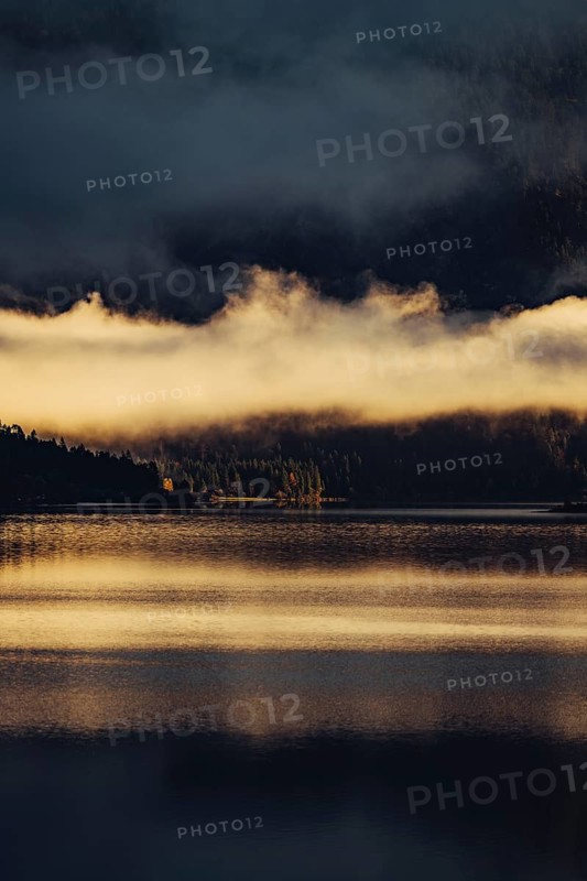 Sunrise with reflections in the Plansee in Tyrol in the Alps in Austria