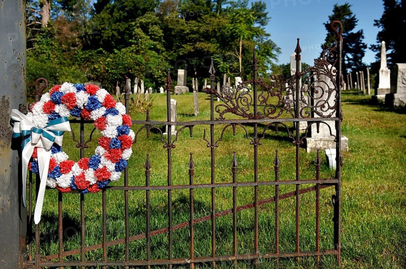 Iron cemetery gate with colourful wreath of artificial stone, Marksboro, New Jersey, USA