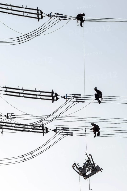 Overhead line fitters working on a high-voltage pylon, overhead lines, energy, worker, high-voltage electrician, Baden-Württemberg, Germany