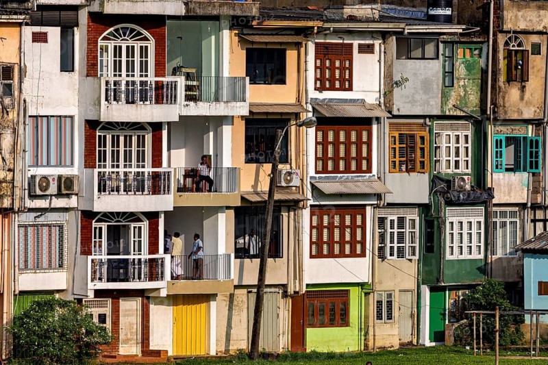 Urban residential complex with various façade colors and balconies, A house facade in Ratnapura in Sri Lanka