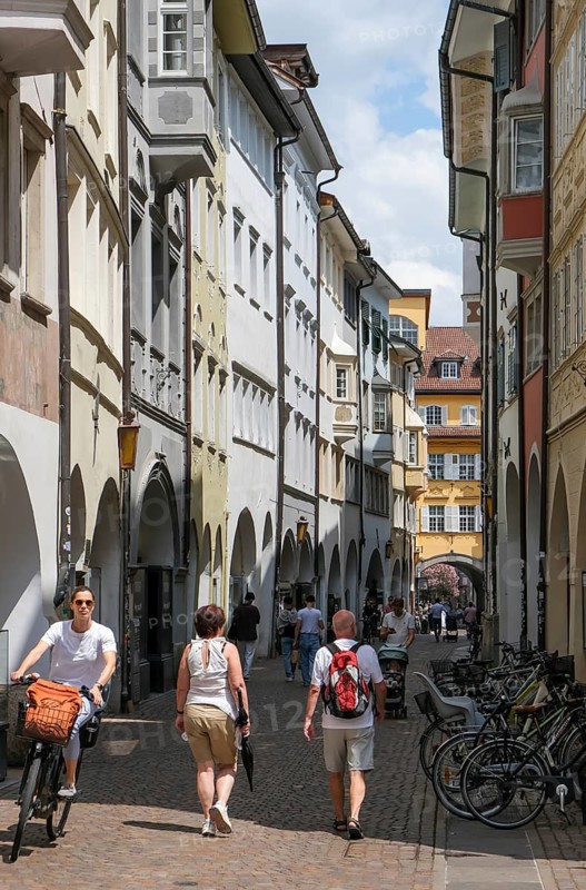 Bolzano, South Tyrol, Italy, Passers-by stroll through the Laubengasse in the old town centre