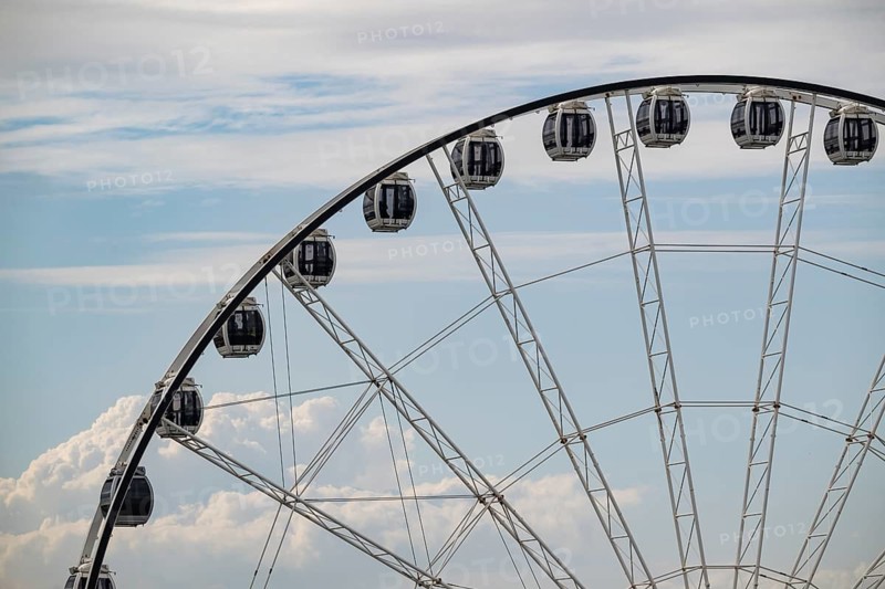 Gondolas, towering Ferris wheel against a cloudy sky, overseas port, Rostock, Mecklenburg-Western Pomerania, Germany