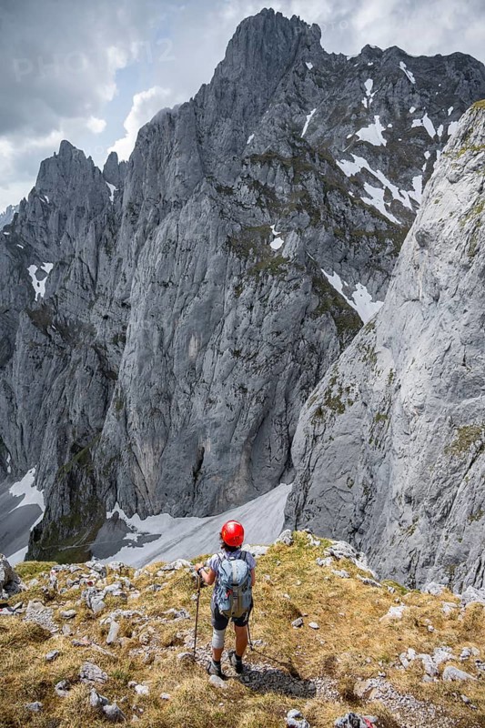 Mountaineer with helmet on a hiking trail, Wilder Kaiser, Kaiser Mountains, Tyrol, Austria