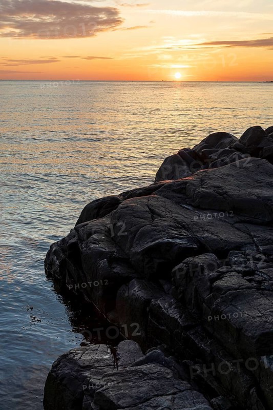 Sunset on the North Sea with archipelago on the west coast near Lerkil, Hallands län, Sweden