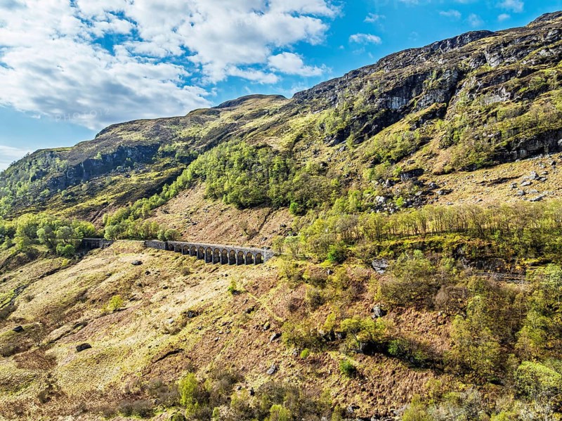 Mountains over Glen Ogle Viaduct from a drone, Road A85, Scotland, UK
