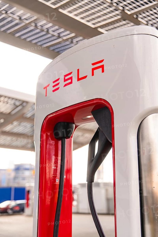 Close-up of a Tesla charging station under a modern canopy, Tesla, New Model Y Juniper, Germany