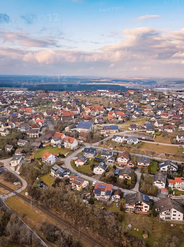 Bird's eye view of the town with various houses and cloudy sky, Schopfloch, Freudenstadt district, Germany