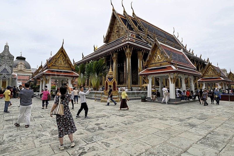 Tourists at Wat Phra Kaew, Temple of the Emerald Buddha, Bangkok, Thailand
