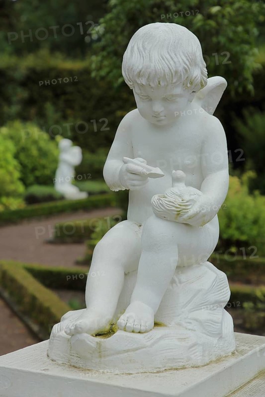 White cherub feeding bird figure in hand, sitting, playing, Russian Garden, Castle Park, Belvedere Palace, Weimar, Thuringia, Germany