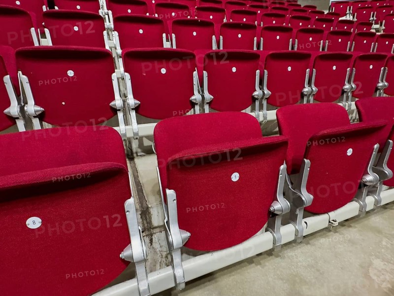 Empty folded-up seats Folding chairs with backrests in rows of seats mounted next to each other Seating in front of event Event in multi-purpose hall, Germany