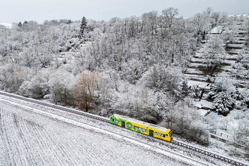 Aerial view of a regional railway on the Strohgäubahn of the type Regio-Shuttle RS 1 in Münchingen, Germany