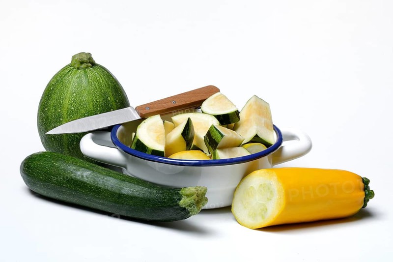 Various courgettes (Cucurbita pepo), courgettes cut up in pot convar. giromontiina